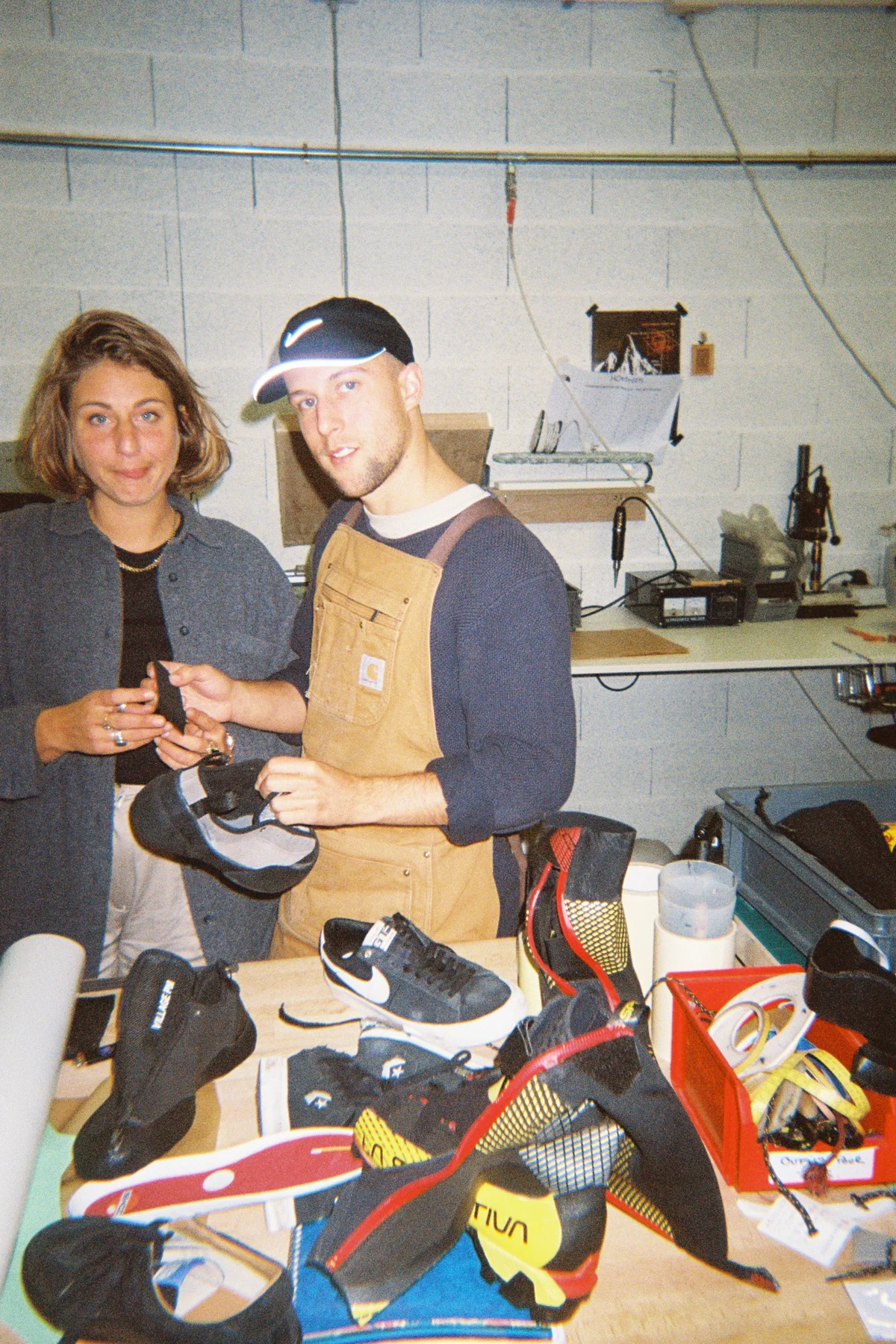 Matteo Challe working on shoe prototypes in a footwear design workshop.
