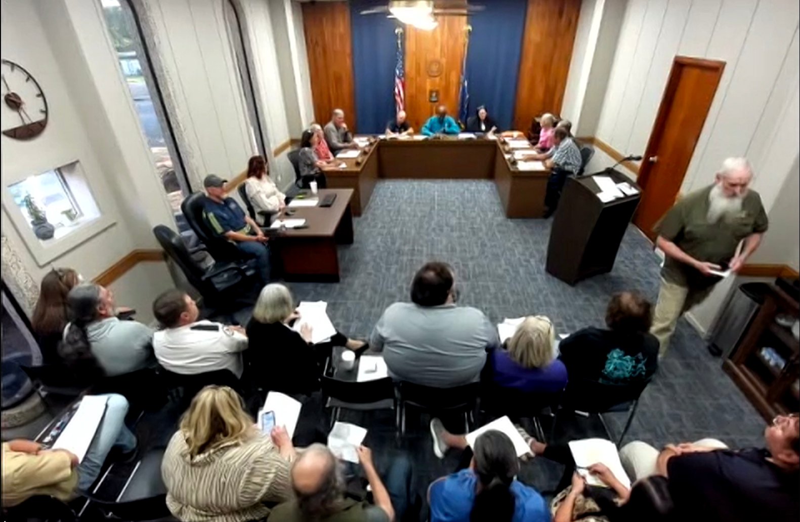 A digital screenshot showing the Grant Parish Police Jury during a public meeting at the Colfax Courthouse.
