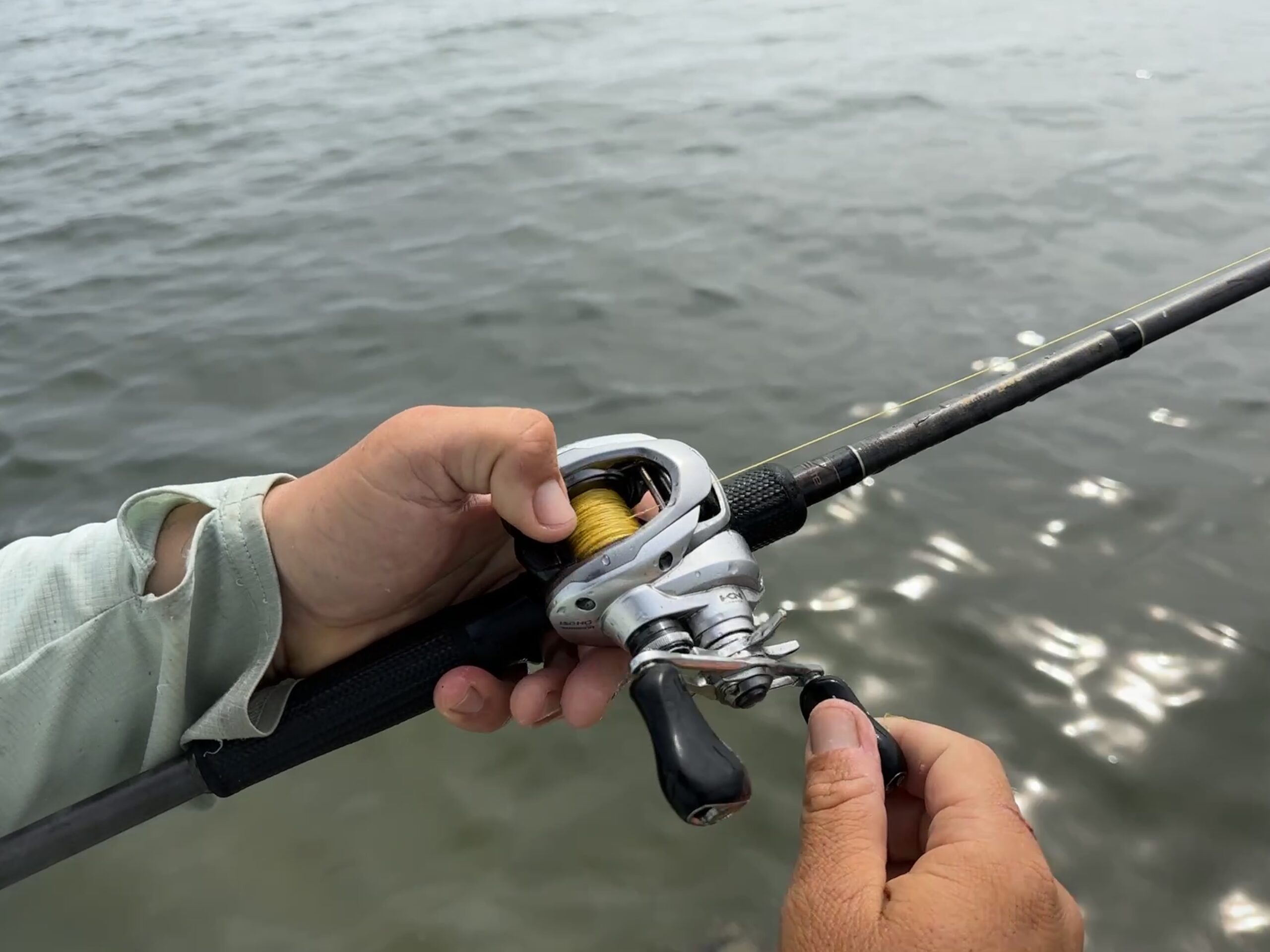 Detailed close-up of a saltwater-ready baitcasting reel showing its robust build.