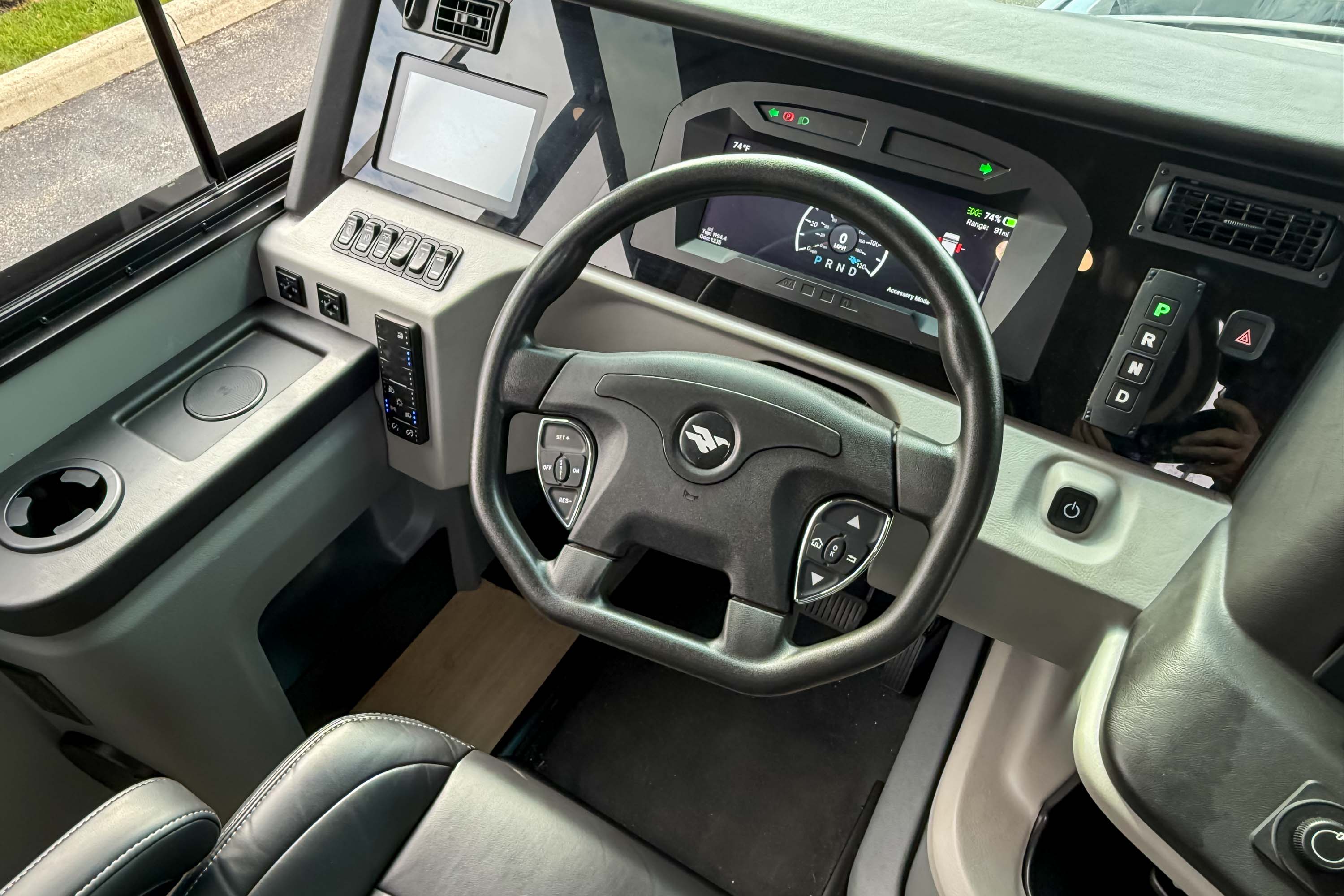 The modern driver's cockpit and digital dashboard of the Entegra Embark.