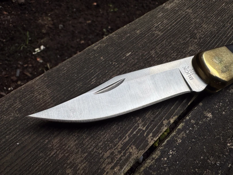 Macro view of the Buck 110's 3.75-inch clip-point blade made of 420HC steel.