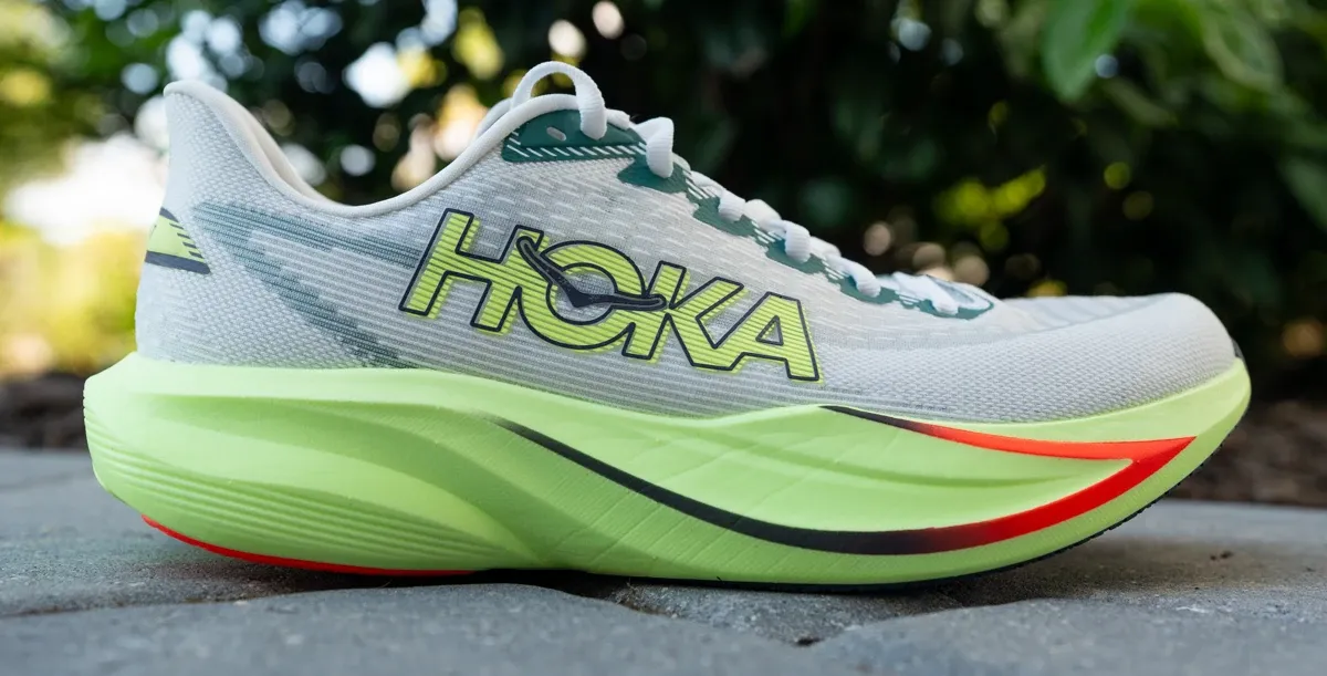 Action shot of a runner utilizing the midfoot strike of the HOKA Mach 7 during a speed workout.
