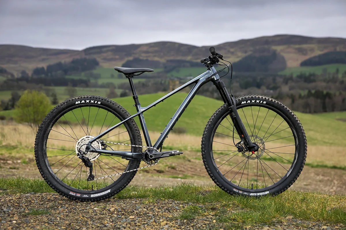 A Giant Fathom 29 mountain bike on a wooded trail.