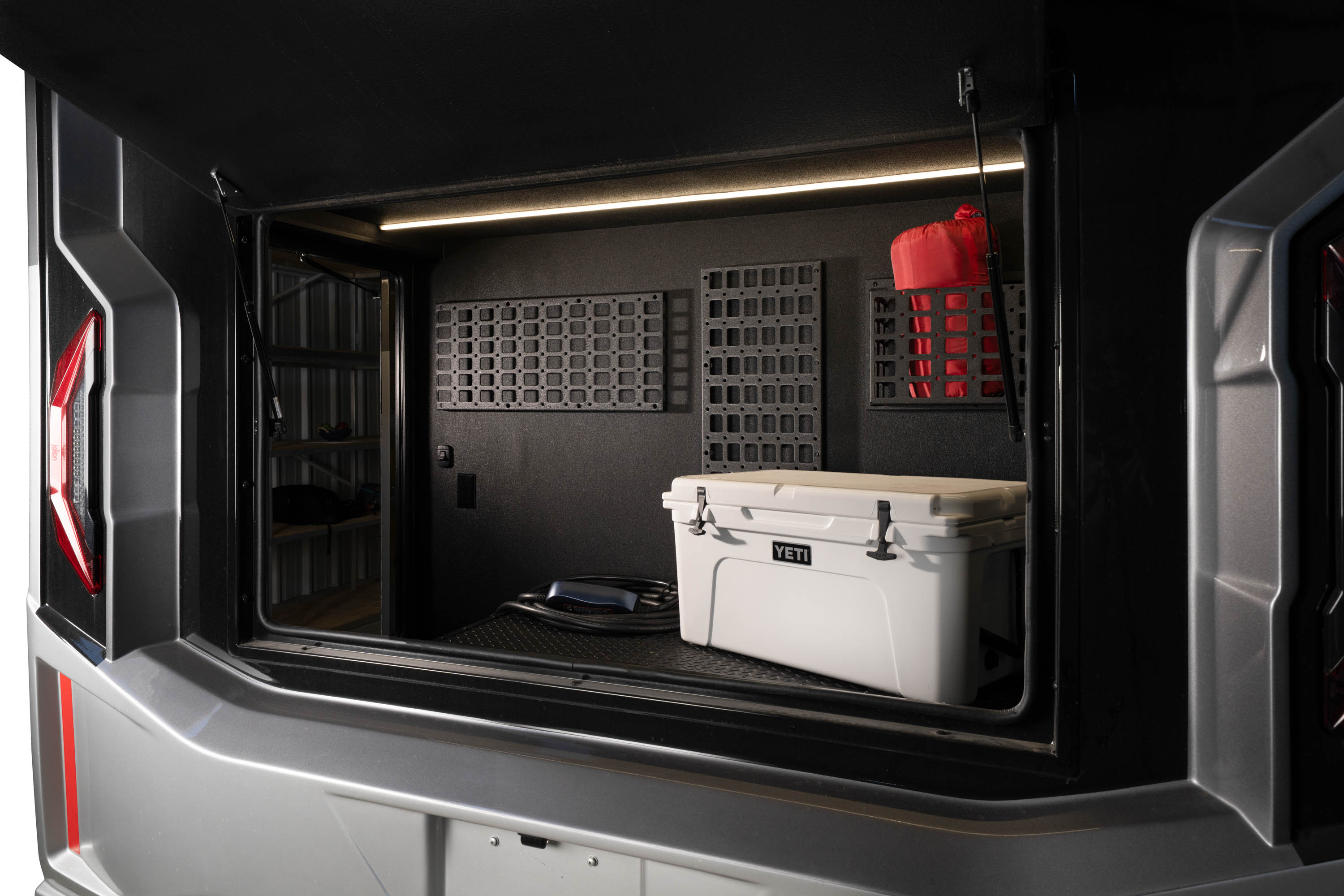 The large pass-through storage compartment at the rear of the motorhome.