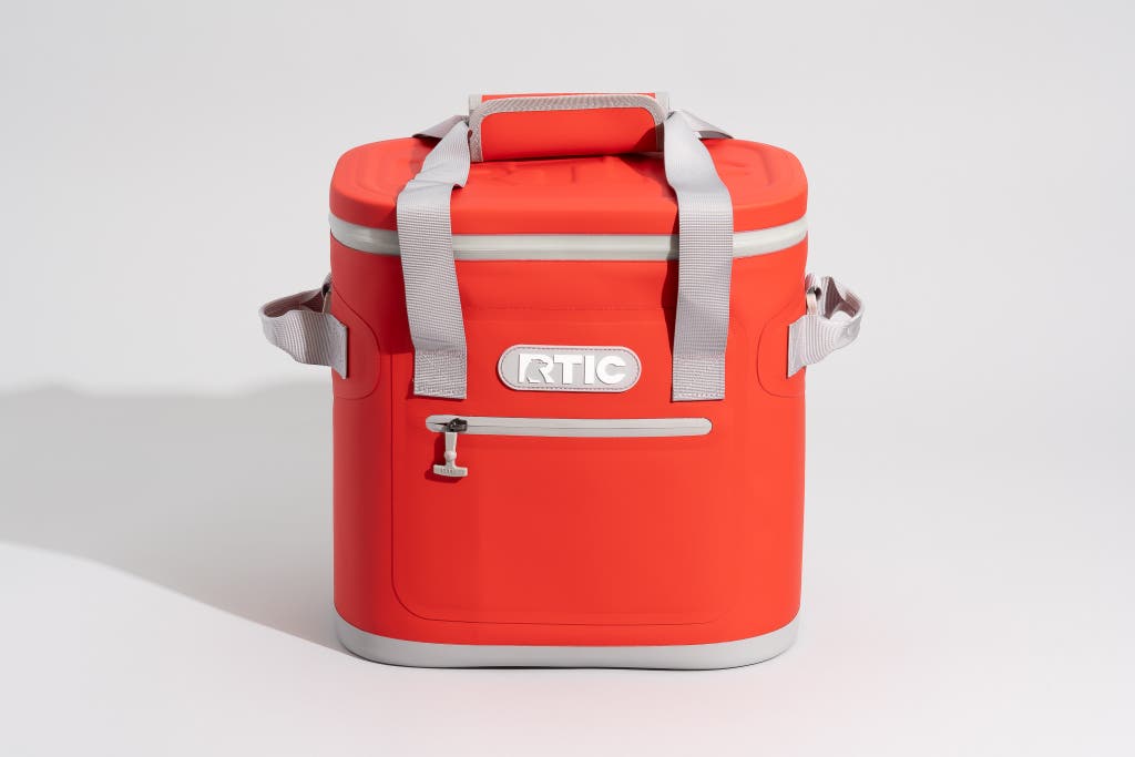 A red RTIC Soft Pack 20-can cooler with a top carry handle