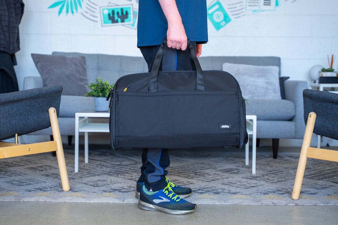 Halfday Premium Garment Duffel 45L unfolded to show garment storage.