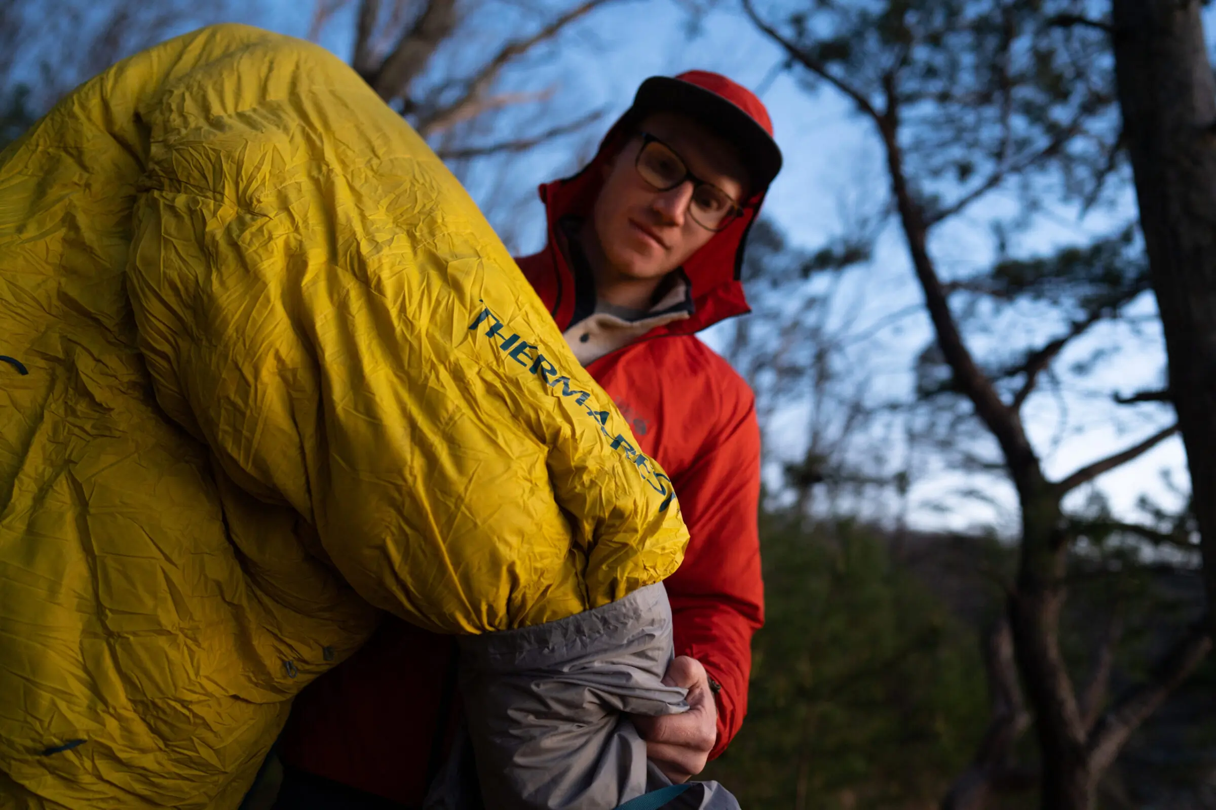 Close-up of high-loft down clusters inside a translucent sleeping bag baffle.