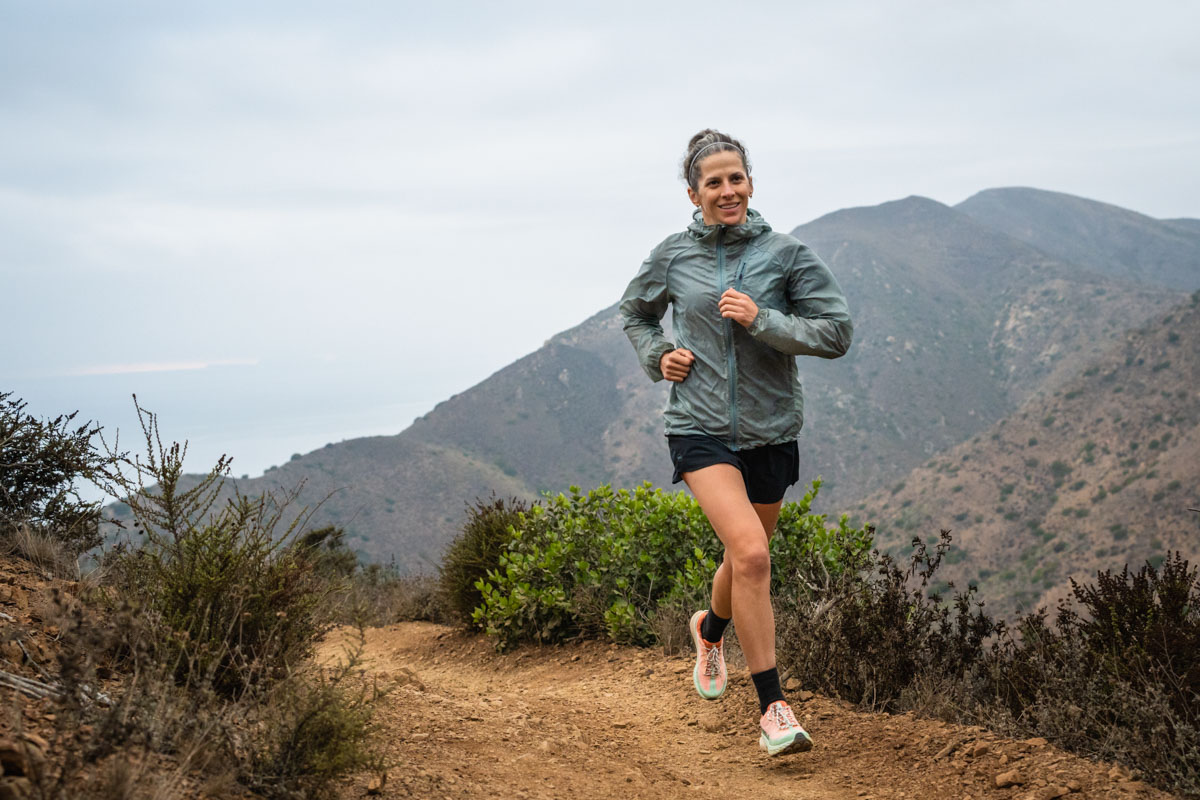 A trail runner testing the Black Diamond Distance Wind Shell on a California trail.