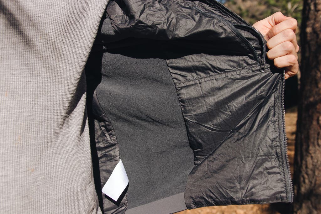 Interior view of a technical jacket showing the baffles and insulation structure.