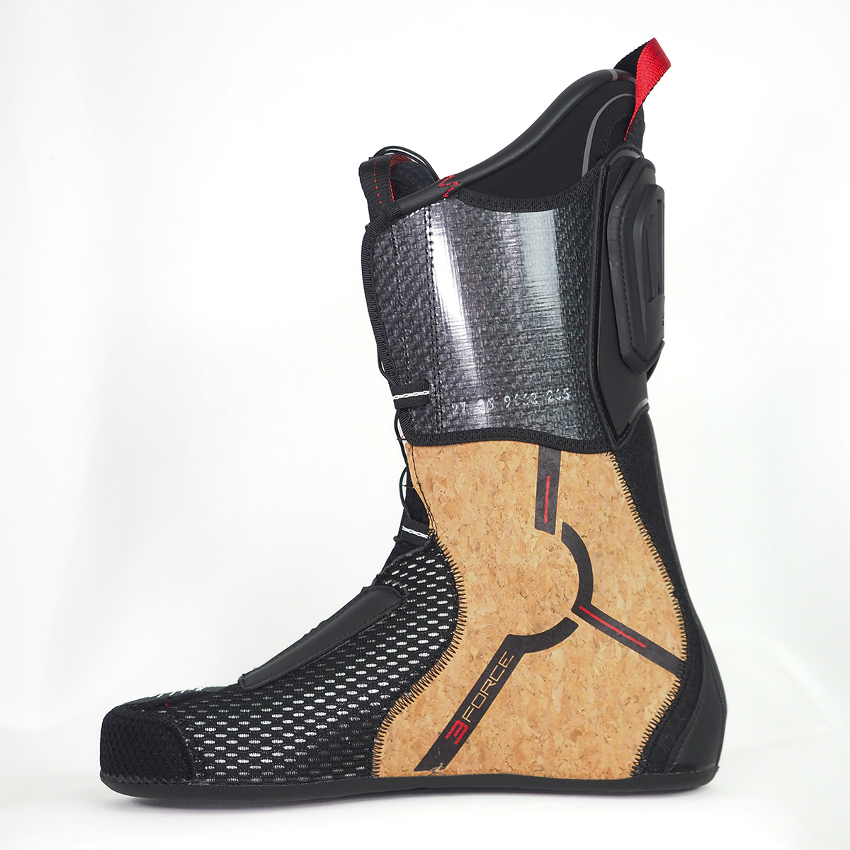 Close-up detail of the black and brown cork material integrated into the ankle section of the ski boot liner.