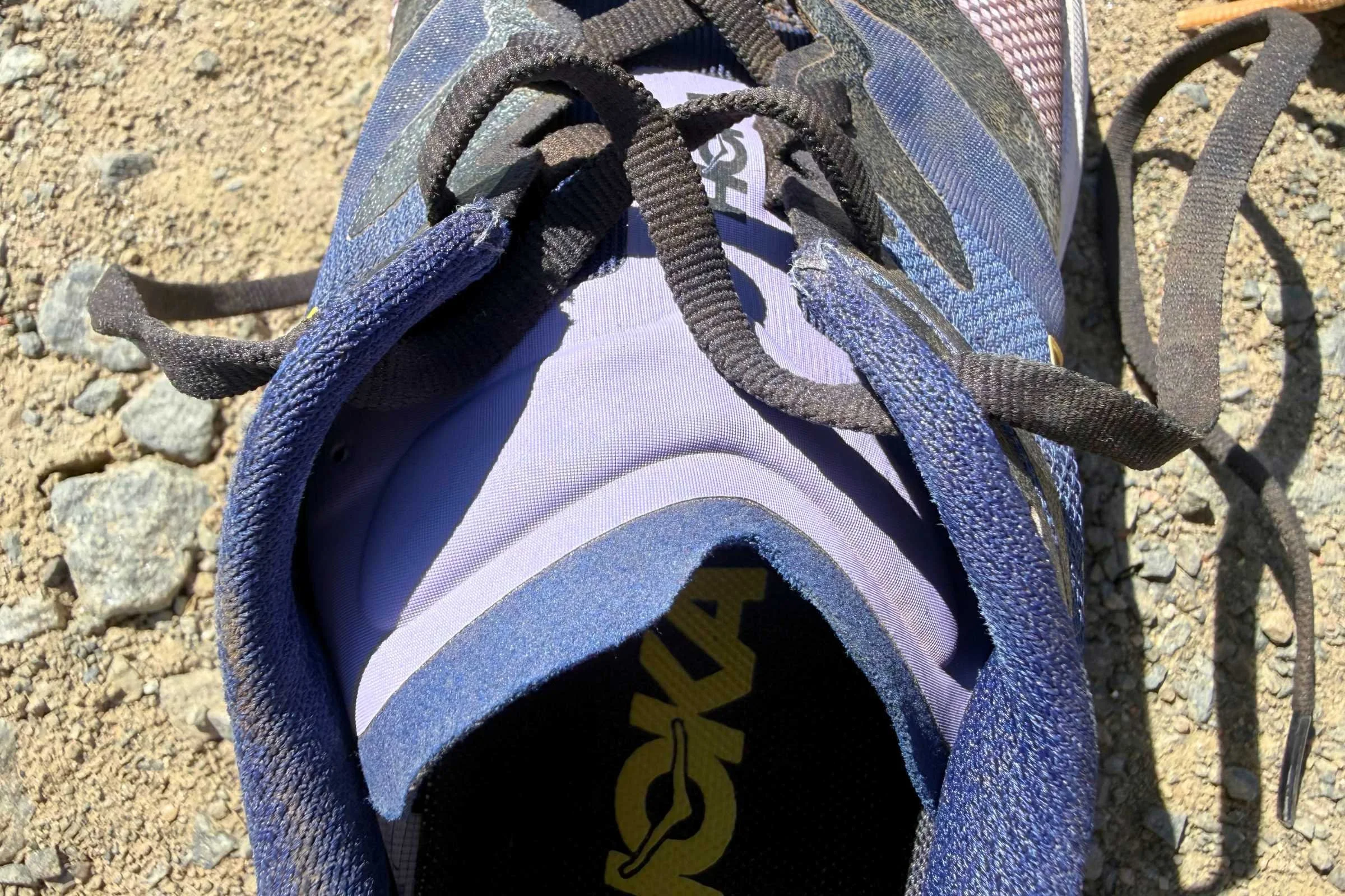 Detail shot of the cushioned tongue and lacing system on the HOKA Speedgoat 7.