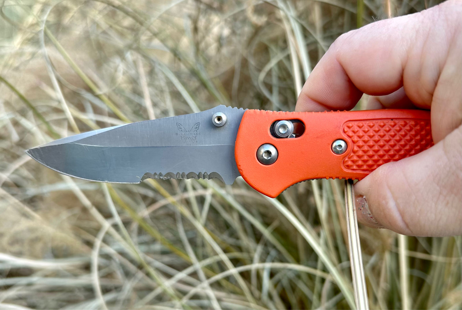 Close-up of a Benchmade pocket knife featuring an Axis lock mechanism.