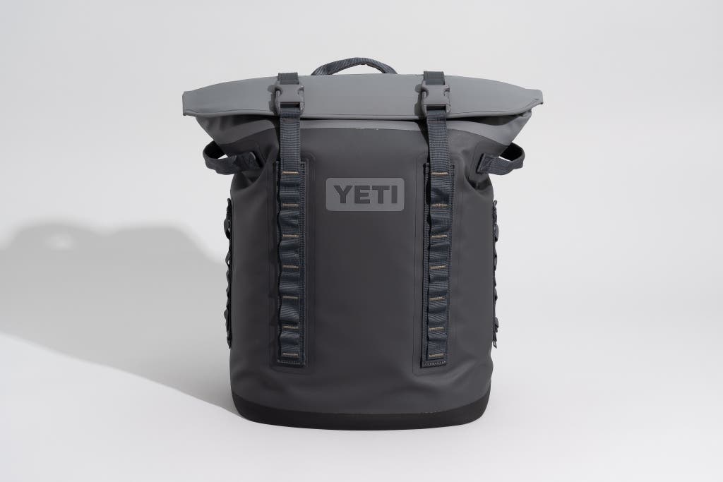 A charcoal and gray Yeti Hopper M20 backpack-style soft cooler