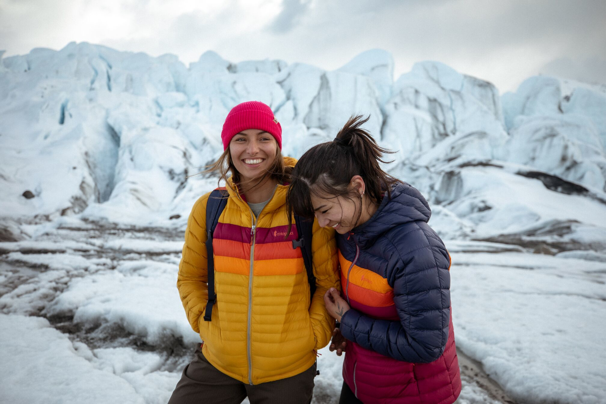 A yellow and blue Cotopaxi Fuego Down Jacket.