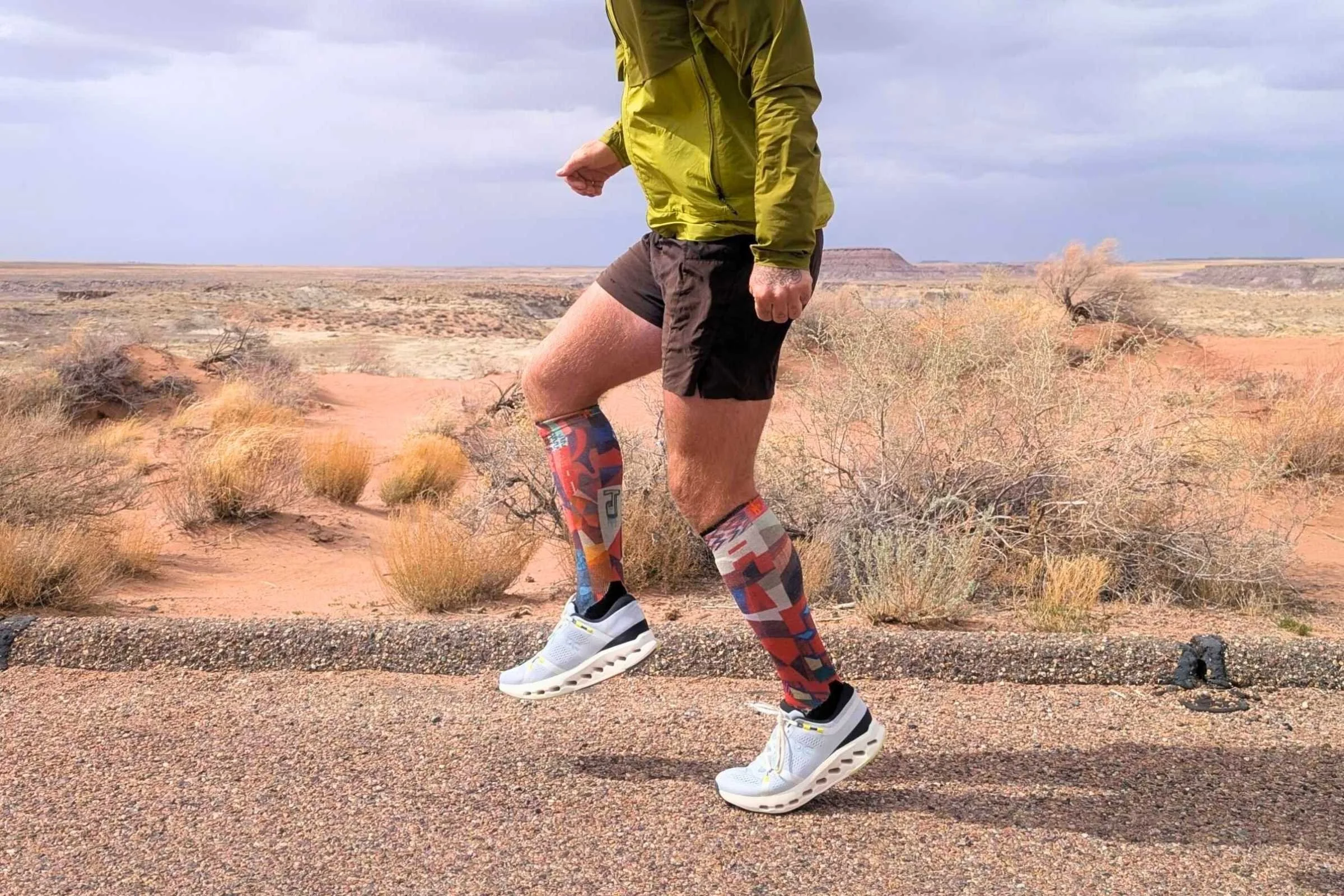 Profile view of the On Cloudsurfer 2 shoes highlighting the cushioning pods.