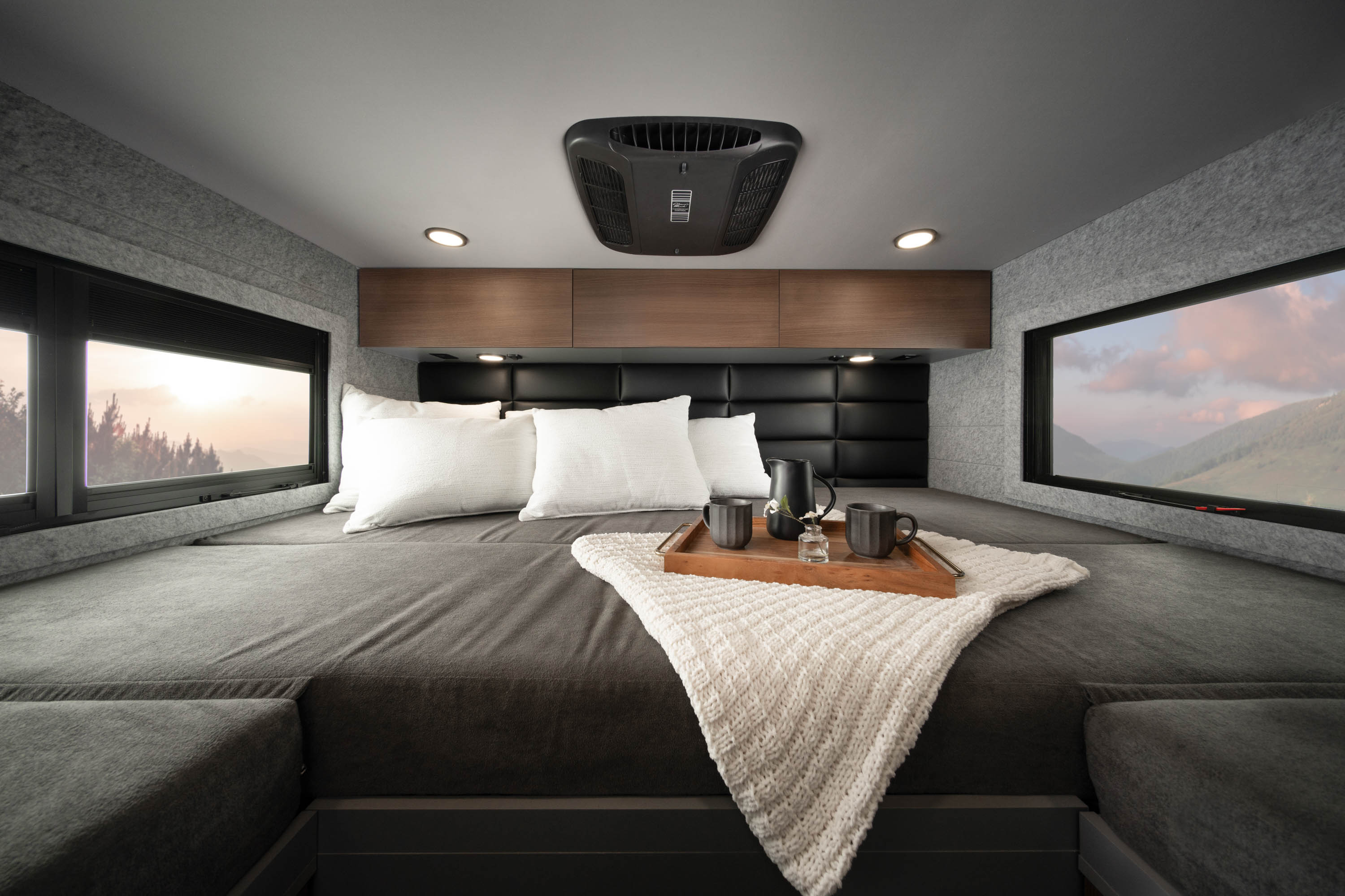 The primary bedroom in the Embark featuring a large king-size bed.