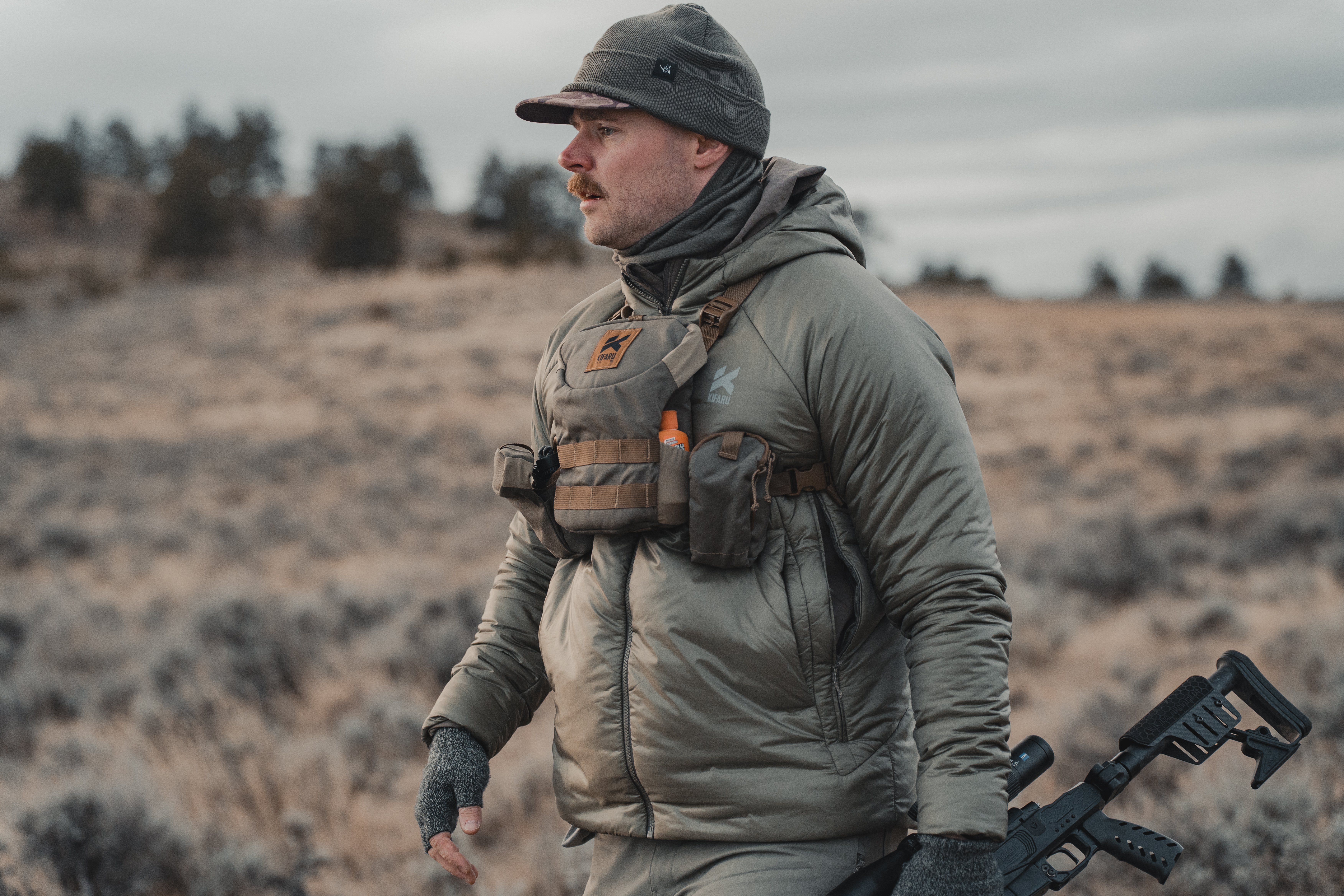 Detail view of the long zipper running from the armpit down the side of the Kifaru jacket.