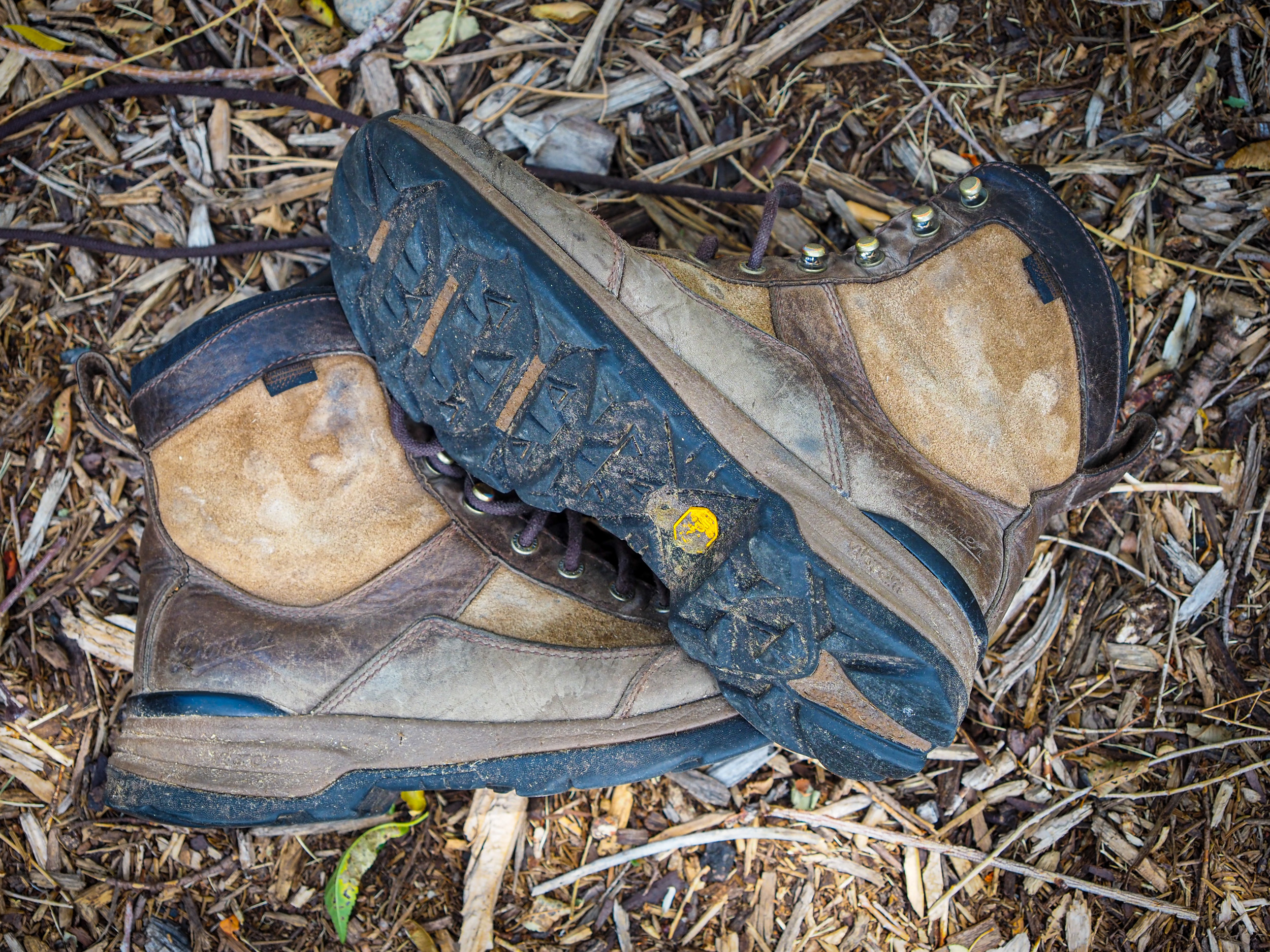 A pair of Danner Recurve hunting boots shown mid-trek during a field test.