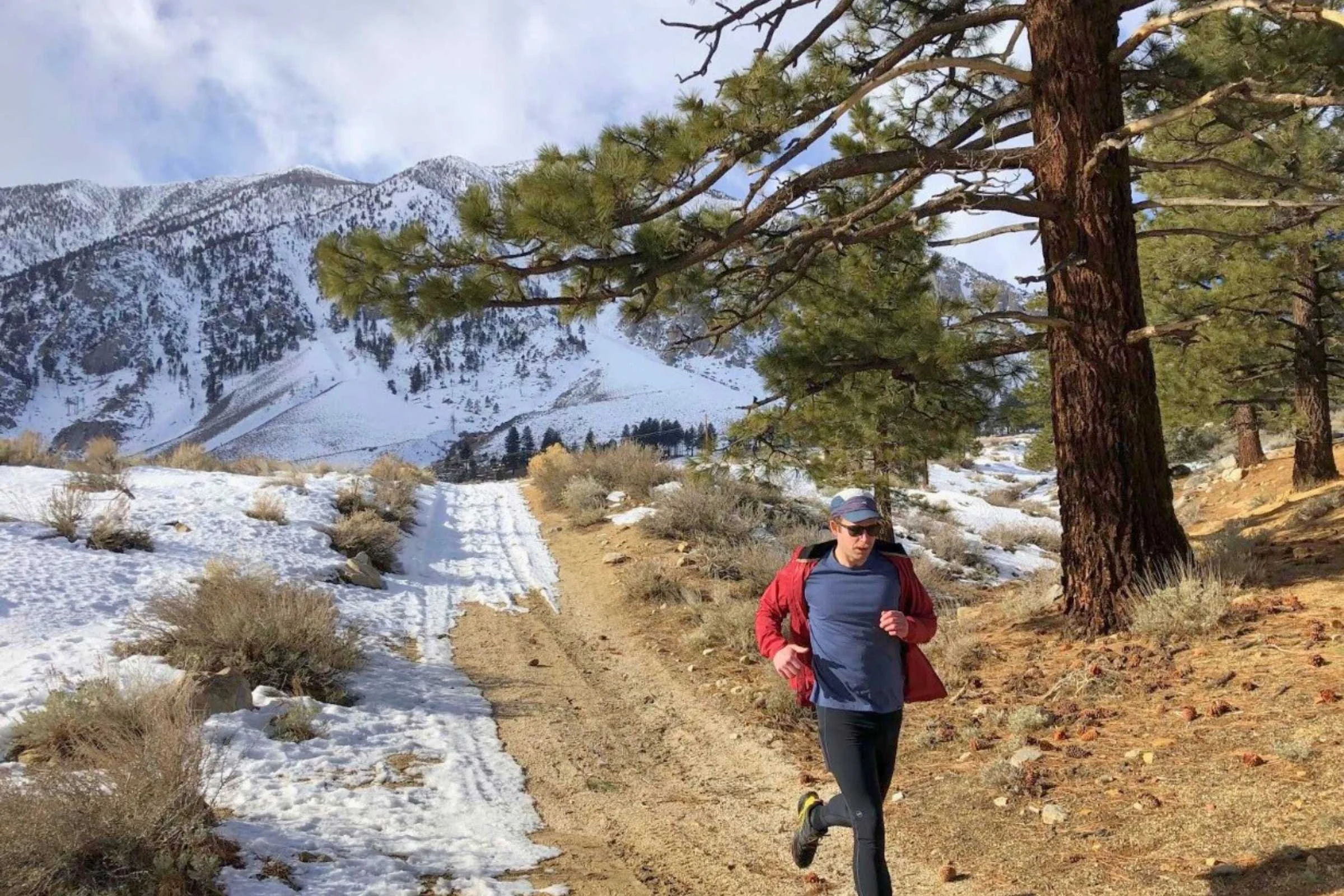 Close-up of a runner wearing the Patagonia Capilene Cool Trail shirt while running.