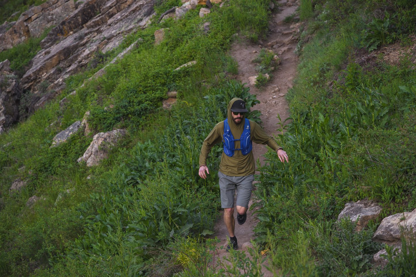 Close-up of the River Run Hoodie showing the buttoned neck closure and integrated thumb loops
