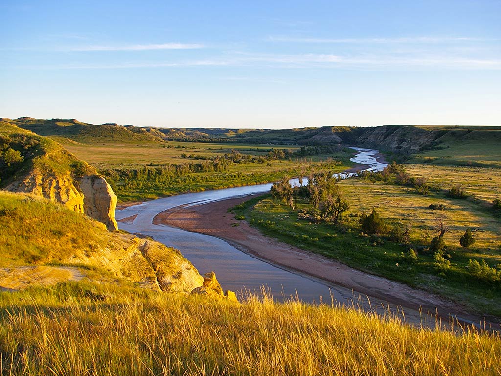Aerial view of the winding Missouri River flowing through the hills of the northern plains.