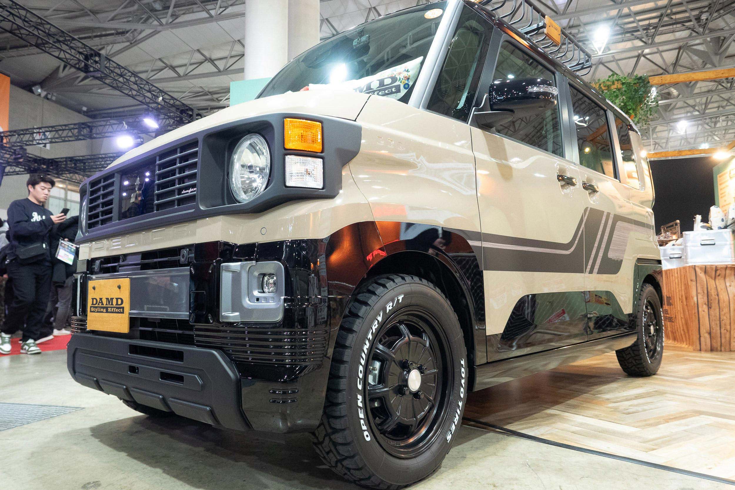 A Mitsubishi Delica Mini featuring a DAMD body kit and rugged off-road wheels.