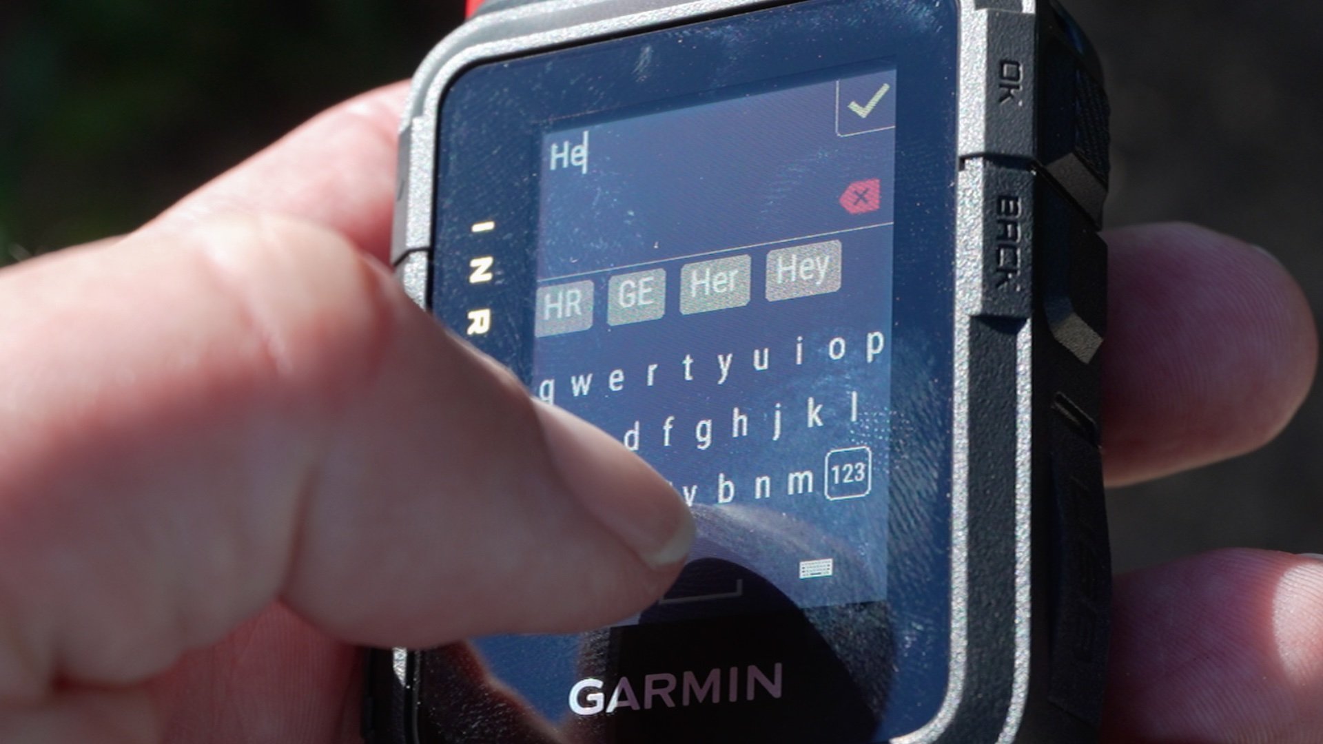 The 1.9-inch color touchscreen of the Garmin inReach Mini 3 Plus showing a QWERTY keyboard layout.