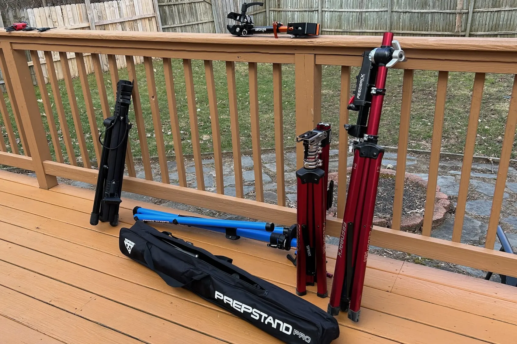 Several bike repair stands shown side-by-side in their folded storage positions.