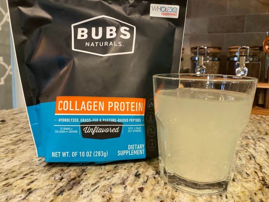 Fine collagen protein powder from Bubs Naturals dissolving clearly in a glass of water.