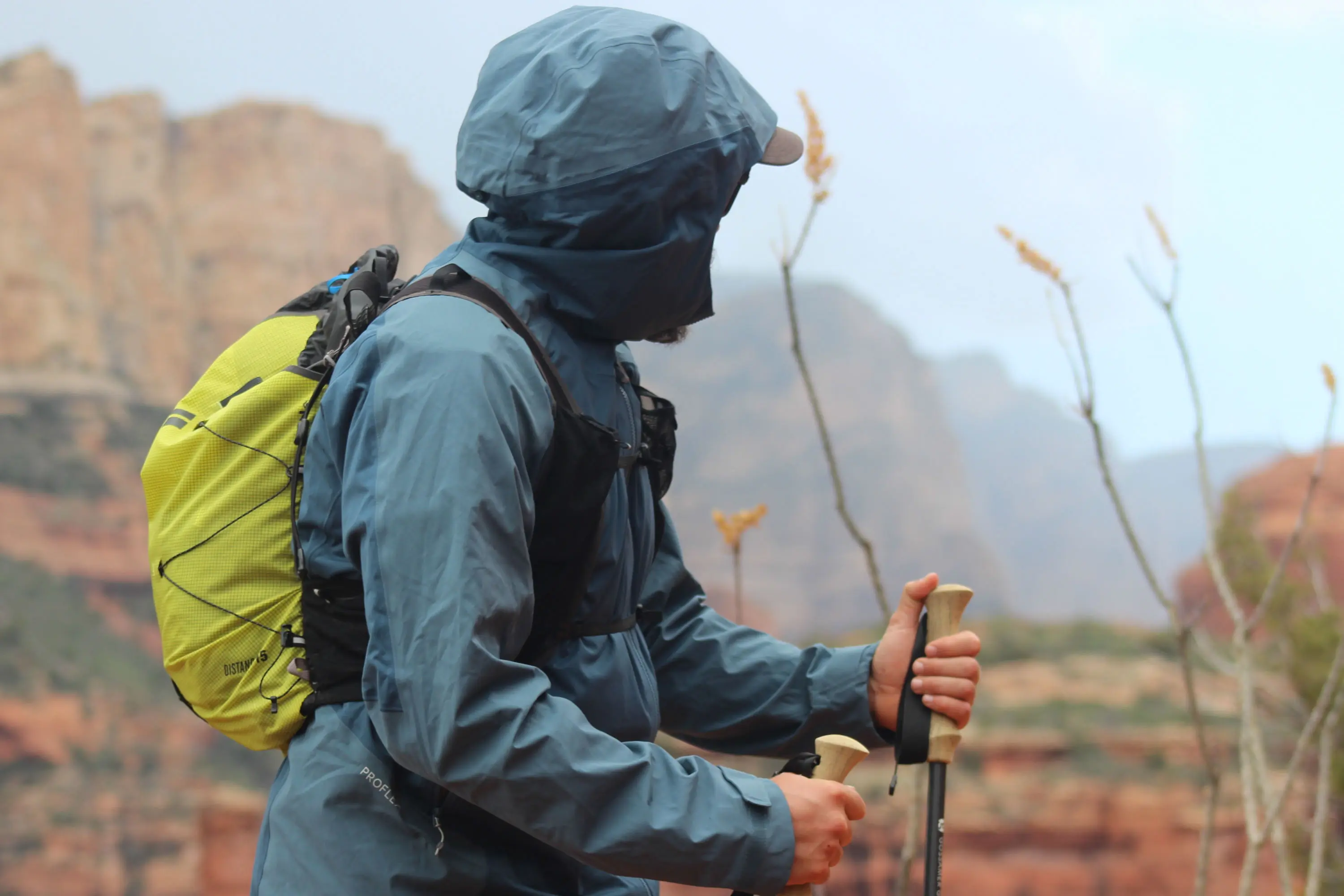 Diagram illustrating the internal layers and breathability of a technical rain jacket.