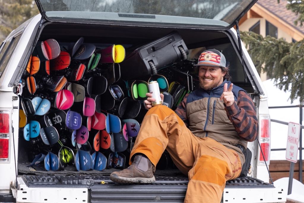 A group of ski testers from the Powder7 team posing together at Loveland Ski Area.