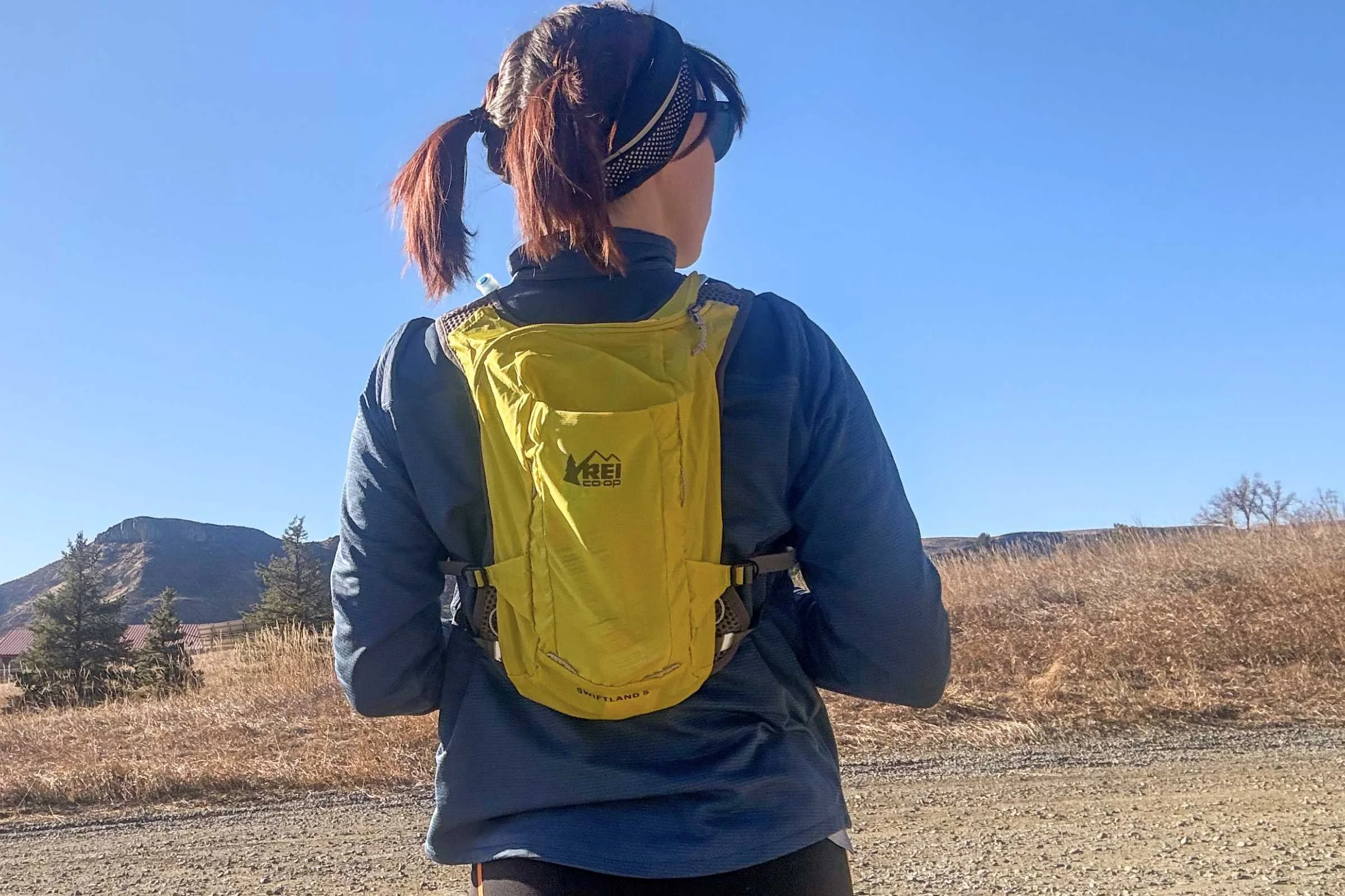 The REI Swiftland hydration vest displayed in different sizing options