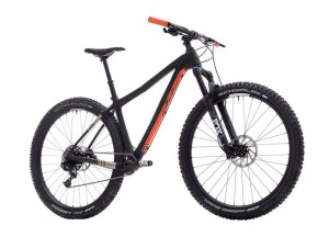 An Ibis DV9 hardtail mountain bike parked on a dirt path.