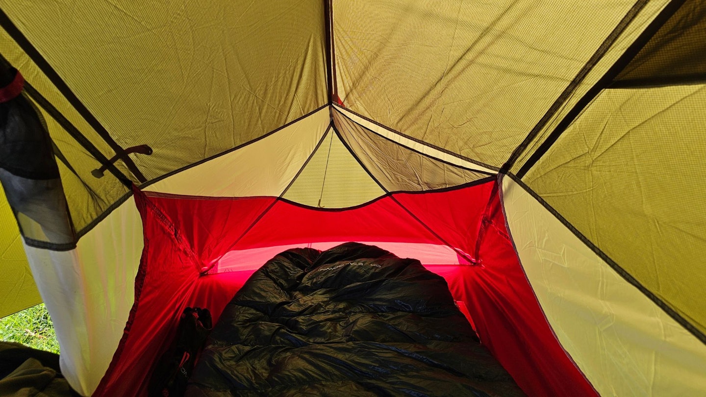 Interior view of a backpacking tent showing the sleeping area and vestibule.